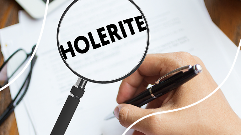 uma lupa sobre um papel escrito "holerite" representando como analisar seu holerite